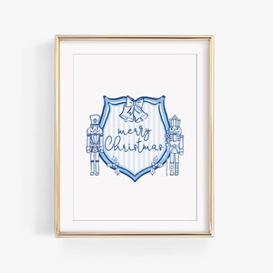 Könnte beinhalten: Ein blaues und weißes druckbares Weihnachtszeichen mit einem Wappen, das zwei Nussknackerfiguren und den Text "merry Christmas" zeigt.