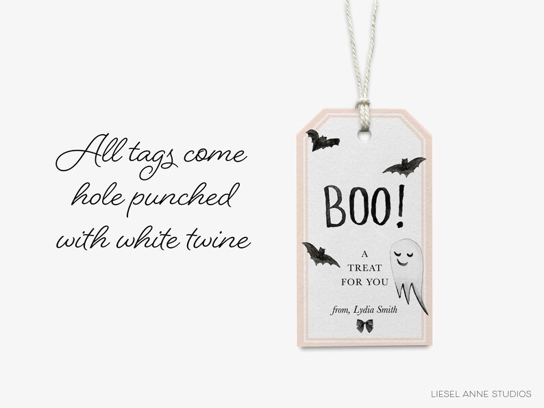 a Halloween-themed tag with the text "All tags come hole punched with white twine" and a ghost decoration.