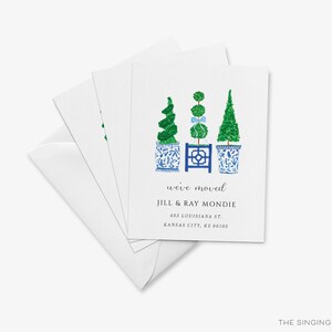 The image is a white card with a design featuring three topiary trees in blue and white pots, along with text indicating that the card is for "Jill & Ray Monde".