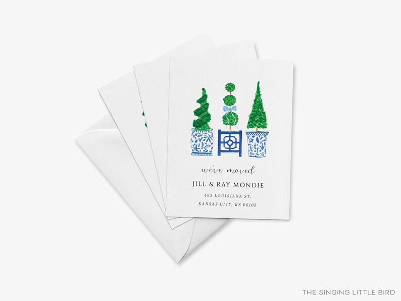 The image is a white card with a design featuring three topiary trees in blue and white pots, along with text indicating that the card is for "Jill & Ray Monde".