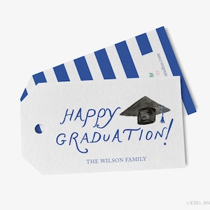 The image is a graduation gift tag with a graduation cap and mortarboard on it, along with the text "Happy Graduation!" and "The Wilson Family".