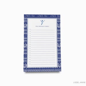 May include: A blue and white notepad with a ski-themed border and the text "APRES SKI" repeated three times. The notepad has a checklist with the text "THE FREEMAN FAMILY" at the top.