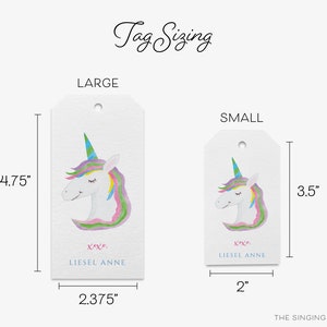 May include: Two gift tags featuring a watercolor illustration of a unicorn with a rainbow mane and horn. The larger tag measures 4.75 inches by 2.375 inches and the smaller tag measures 3.5 inches by 2 inches. Both tags have the text "XX" and "LIESEL ANNE" printed on them.