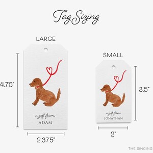 May include: Two gift tags featuring a watercolor illustration of a brown dog with a red heart-shaped leash. The larger tag measures 4.75 inches by 2.375 inches and says "a gift from. ADAM". The smaller tag measures 3.5 inches by 2 inches and says "a gift from. JONATHAN".