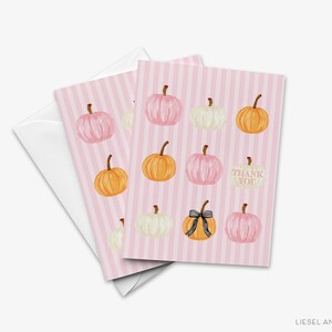 A pink striped card with illustrations of pumpkins and a "Thank You" message.