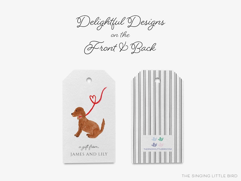 May include: A gift tag with a watercolor illustration of a brown dog on a red leash with a heart at the end. The text on the tag reads "a gift from. JAMES AND LILY". The back of the tag has black and white stripes and the text "THE SINGING LITTLE BIRD.COM".