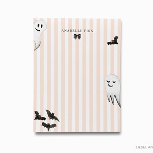 a pink and white striped background with three ghostly figures and bats.