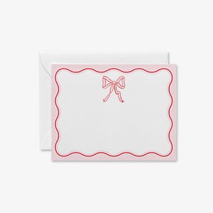 May include: Pink note card with a red scalloped border and a pink bow in the center.