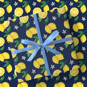 a wrapping paper with a blue bow and a pattern of lemons