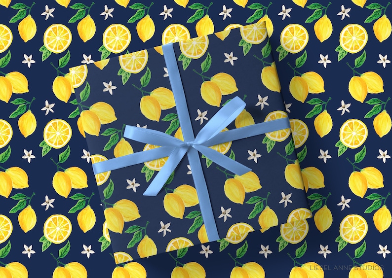 a wrapping paper with a blue bow and a pattern of lemons