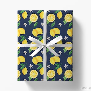 a present wrapped in a blue wrapping paper with lemons on it