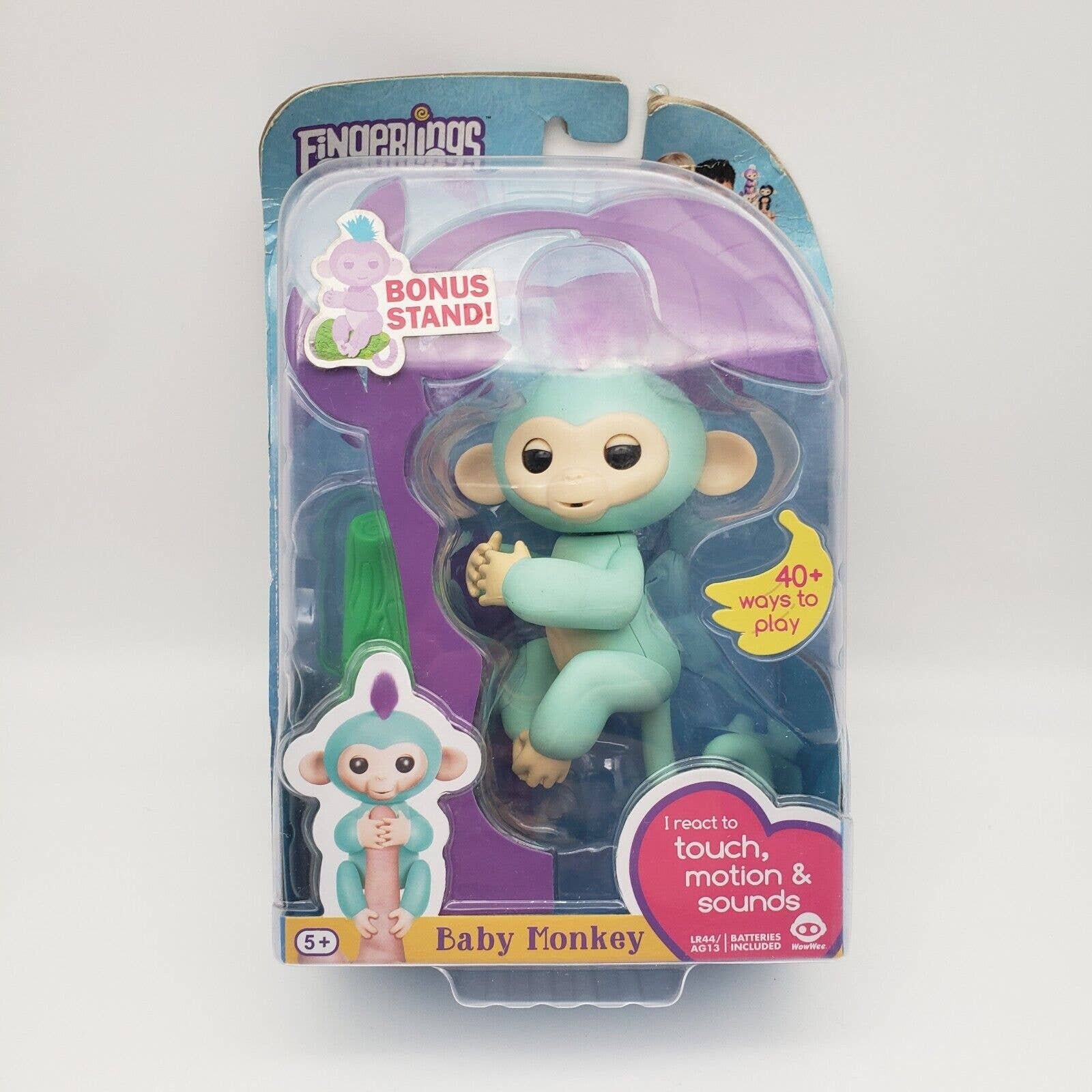 Fingerlings - Interactive Baby Monkey - Zoe (Turquoise with Purple Hair) By  WowWee