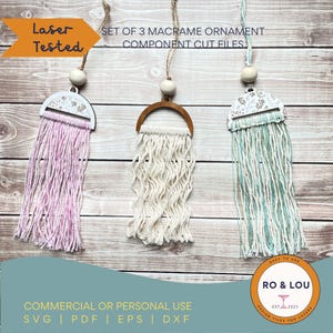 May include: Three macrame ornaments with wooden details and hanging strings. Each ornament has a different colour of fringe: pink, cream, and teal. The image text says "Laser Tested" and "Set of 3 Macrame Ornament Component Cut Files."