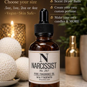 May include: A brown glass bottle of Narcissist No. 267 pure fragrance oil with a black dropper. The label reads "M & T SCENTS". The image also includes text that says "Free Shipping", "Choose your size .5oz, 1oz, 2oz or 4oz", and "Vegan Skin Safe".