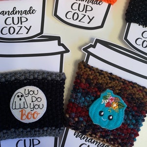 Fall/Halloween themed hand knitted cup cozies