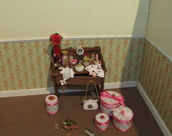Dollhouse miniatures vanity with perfumes and other items