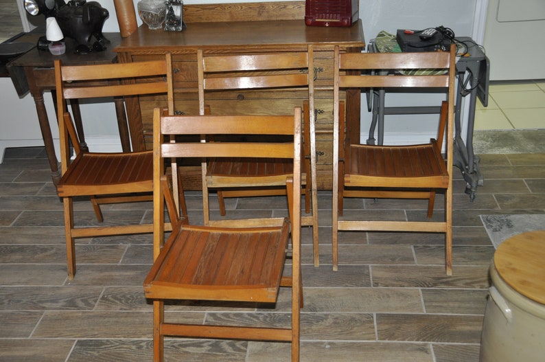 Four Hard Wood Fold Up Chairs