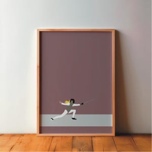 May include: Framed art print showing a minimalist illustration of a fencer. The artwork depicts a figure in white fencing attire with a black helmet and a yellow ponytail, set against a mauve background with a grey stripe.