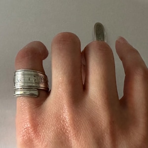 A Monogram Antique silverplate wrap around spoon ring Grosvenor pattern