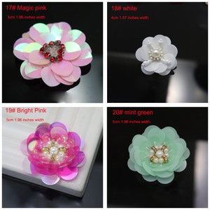 May include: Four decorative flower appliques with sequin petals. 17# Magic pink is 1.96 inches wide with red crystals. 18# White is 1.57 inches wide with white beads. 19# Bright Pink is 1.96 inches wide. 20# Mint green is 1.96 inches wide.