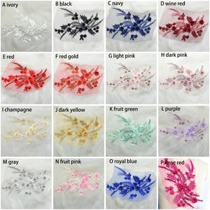 May include: A collection of 16 different colored fabric flower appliques. The appliques are arranged in a grid of four rows and four columns. Each applique is a different color, including ivory, black, navy, wine red, red, red gold, light pink, dark pink, champagne, dark yellow, fruit green, purple, gray, fruit pink, royal blue, and rose red.