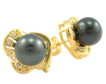 May include: A pair of gold earrings with black pearls and small diamonds. The earrings are in the shape of a swirl with a pearl in the center.