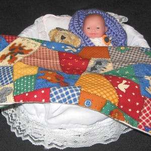 Baby Doll with Teddy in White Basket