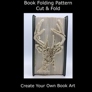 May include: A book with a deer head design created by folding and cutting the pages. The text "Book Folding Pattern Cut & Fold" is at the top, and "Create Your Own Book Art" is at the bottom.