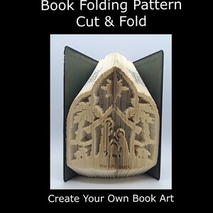May include: A book folded into a 3D sculpture of trees. The book is open and the pages are folded to create the shape of the trees. The book is titled "The Gift Library".