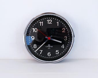 1980's Lorenz wall clock with black dial and chrome frame