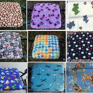 May include: Nine different walker seat cushions with various colorful patterns. The patterns include paw prints, hearts, cartoon animals, and airplanes. The cushions are made of soft fabric and are designed to provide comfort and support for walkers.