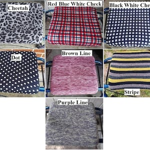 May include: A set of 8 walker seat cushions in various patterns and colors, including cheetah print, red and blue plaid, black and white checkered, polka dot, brown and pink striped, yellow and black striped, and purple and gray striped.