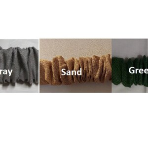 May include: Three fabric swatches in different colors: gray, sand, and green. The fabric is a textured, woven material.