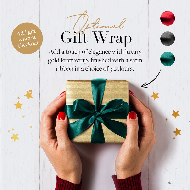 May include: A gold gift box with a green satin ribbon. The text "Optional Gift Wrap" is above the box. The text "Add a touch of elegance with luxury gold kraft wrap, finished with a satin ribbon in a choice of 3 colours." is below the box. The text "Add gift wrap at checkout" is in a circle in the upper left corner of the image.