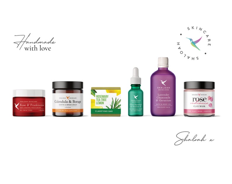 May include: A set of six natural skincare products from Shaloah Skincare. The products include a rose and frankincense anti-aging moisturizer, a calendula and borage soothing and repair cream, a rosemary, tea tree, and lemon clarifying bar, a rose radiance clay mask, a lavender, chamomile, and geranium bath and body oil, and a rosehip oil with vitamin E serum. The products are all packaged in white jars and bottles with black lids and labels.