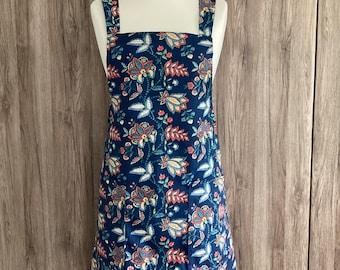 Small, medium, large, extra large cross back apron with two pockets. Wrap around apron in dark blue floral fabric. Maharishi Midnight.