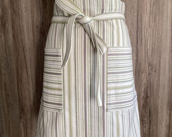 Striped half apron in green, grey, off white. Wide apron, long straps, two pockets. Premium quality woven cotton fabric; Somerville Olive.
