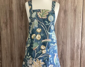 Medium cross back apron with two pockets. Wrap around apron in Iliv Chanterelle Mirage cotton fabric. Misty blue with birds and flowers.