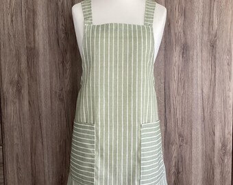 Small, medium cross back apron with two pockets. Japanese apron in green and white striped cotton fabric. Iliv pencil stripe lemongrass.