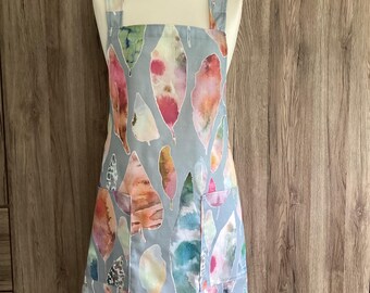 Extra large, XL cross back apron with two pockets. Japanese wrap around apron in blue, grey with large leaves. No tie apron.