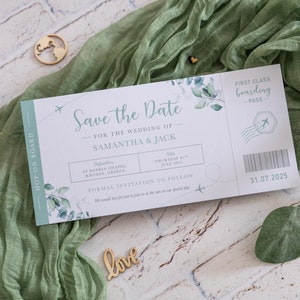 May include: A save the date card designed to look like an airline boarding pass. The card is white with green foliage and text that reads "Save the Date" for the wedding of Samantha & Jack. The date is listed as Thursday, 31 July 2025. The card also includes the location of the wedding, St. Sophia Chapel, Rhodes, Greece.
