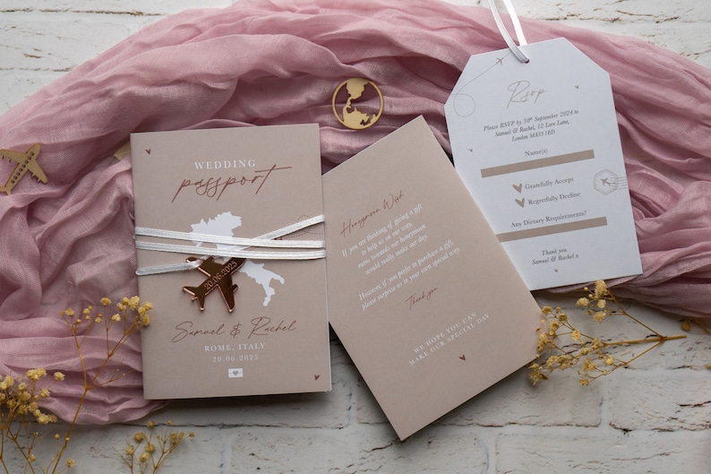 May include: Wedding passport invitation with a gold airplane charm and the text "Wedding Passport". The invitation includes the names Samuel & Rachel, and the date 29.06.2025. A matching RSVP card is also included.