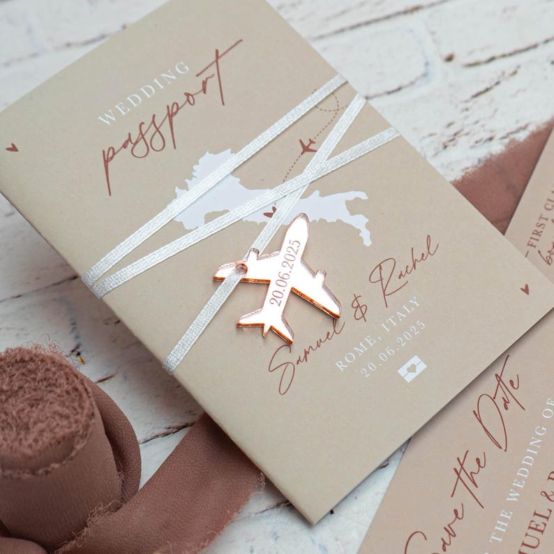 Beige wedding passport invitation with rose gold acrylic plane aeroplane charm for destination wedding