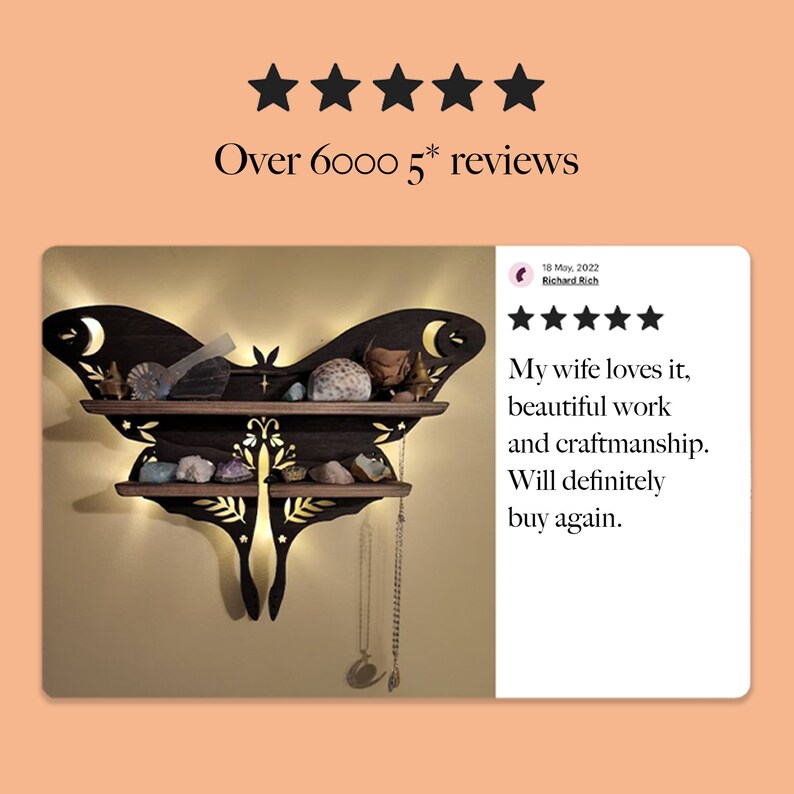 May include: Dark brown wooden wall shelf shaped like a moth with two shelves.  Gold leaf accents and crescent moon cutouts are visible.  The shelf displays various crystals, stones, and small decorative objects.  LED lights illuminate the shelf from behind.  Customer review text reads: 'My wife loves it, beautiful work and craftsmanship. Will definitely buy again.'  Five stars and the date 18 May 2022 are also visible.  The overall theme is bohemian or witchy decor.