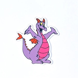 May include: A cartoon sticker of a purple dragon with orange wings, horns, and tail. The dragon has a pink belly and is smiling with its arms outstretched. The sticker is on a white background.