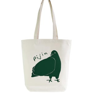 May include: A white canvas tote bag with a green illustration of a pigeon and the word "Pijin" printed on the front.