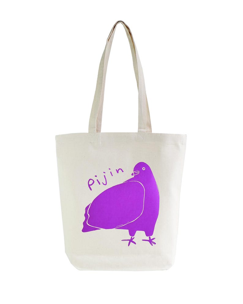 May include: A white canvas tote bag with a purple pigeon illustration and the word "Pijin" printed on the front.