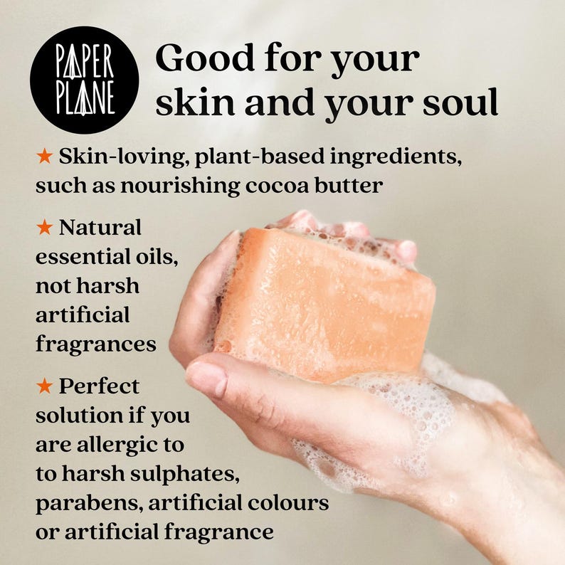 May include: A close-up of a person's hands holding a bar of orange soap. The soap is surrounded by white bubbles. The text "Good for your skin and your soul" is written in black text on a white background. The text "Skin-loving, plant-based ingredients, such as nourishing cocoa butter" is written in black text on a white background. The text "Natural essential oils, not harsh artificial fragrances" is written in black text on a white background. The text "Perfect solution if you are allergic to harsh sulphates, parabens, artificial colours or artificial fragrance" is written in black text on a white background.