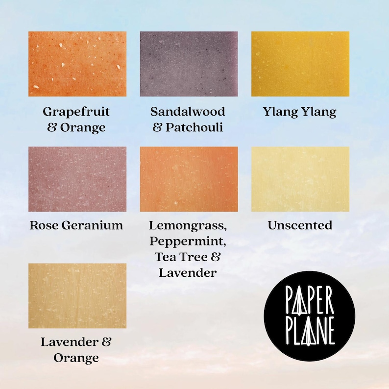 May include: A set of nine soap bars with different scents, including grapefruit and orange, sandalwood and patchouli, ylang ylang, rose geranium, lemongrass, peppermint, tea tree and lavender, lavender and orange, and unscented. The soap bars are arranged in a grid pattern on a light blue background. The text "PAPER PLANE" is printed in black on a white circle in the lower right corner of the image.