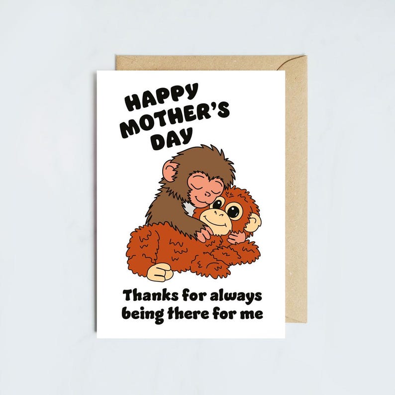 May include: A greeting card for Mother's Day with a cartoon illustration of two monkeys hugging. The card reads "Happy Mother's Day" and "Thanks for always being there for me" in black text. The card is white with a brown envelope.